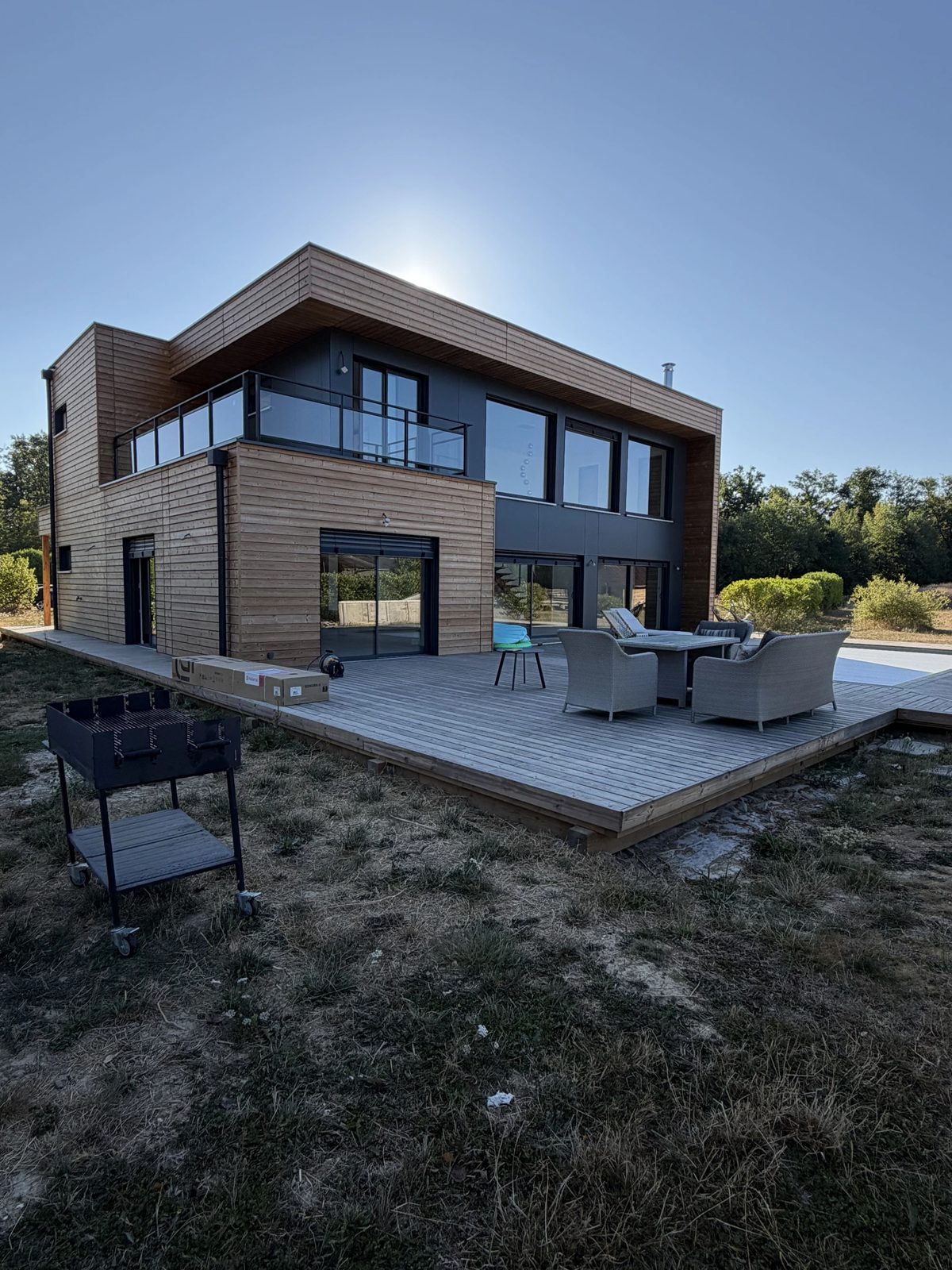 Maison à ossature bois avec terrasse — réalisation Le Cocon Français